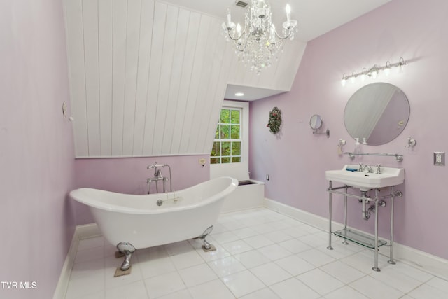 133 Knob Creek Dock Rd, Johnson City, TN 37601 - full bathroom with a freestanding bath, a chandelier, baseboards, and tile patterned flooring