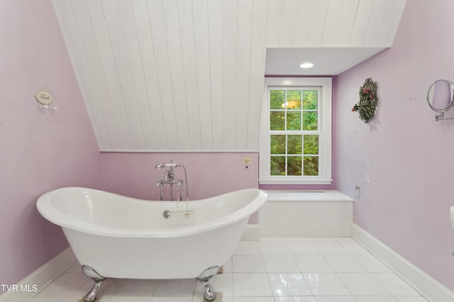 133 Knob Creek Dock Rd, Johnson City, TN 37601 - bathroom with a soaking tub, tile patterned flooring, and baseboards