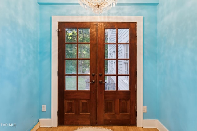 133 Knob Creek Dock Rd, Johnson City, TN 37601 - doorway to outside featuring french doors, baseboards, a chandelier, and healthy amount of natural light