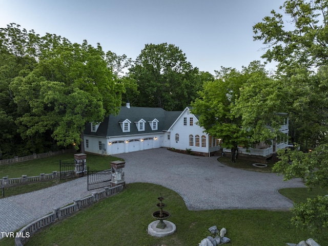 133 Knob Creek Dock Rd, Johnson City, TN 37601 - cape cod-style house with driveway, a deck, and an attached garage