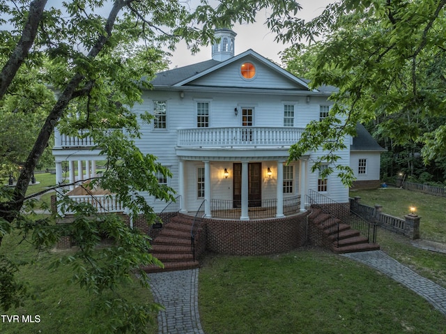 133 Knob Creek Dock Rd, Johnson City, TN 37601 - neoclassical home featuring a front lawn, covered porch, and a balcony