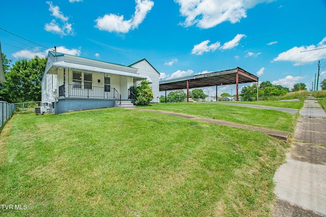 1002 Massachusetts Ave, Bristol, VA 24201 - view of front of home featuring covered porch, a detached carport, and driveway