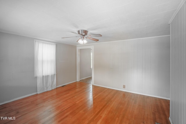 1002 Massachusetts Ave, Bristol, VA 24201 - empty room with hardwood / wood-style floors, ceiling fan, and wooden walls