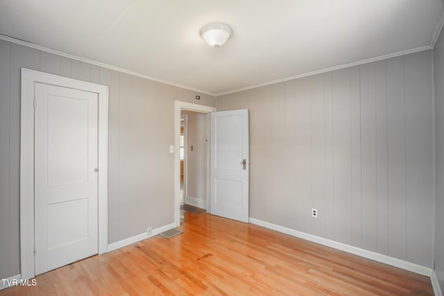1002 Massachusetts Ave, Bristol, VA 24201 - unfurnished bedroom with light wood-type flooring and ornamental molding