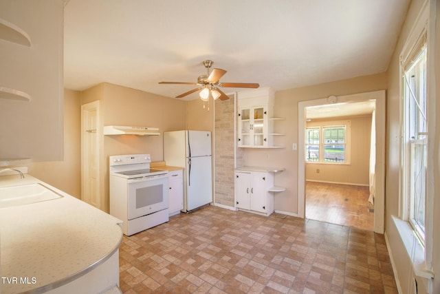 1002 Massachusetts Ave, Bristol, VA 24201 - kitchen with open shelves, white appliances, under cabinet range hood, ceiling fan, and light countertops