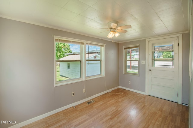 1002 Massachusetts Ave, Bristol, VA 24201 - empty room with light wood-style flooring, a ceiling fan, plenty of natural light, and crown molding