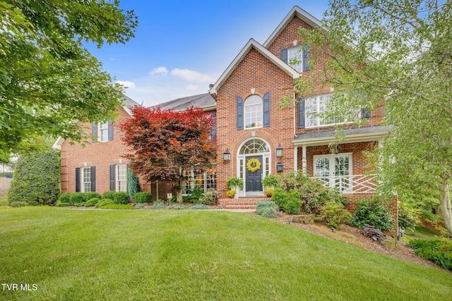 117 Quail Heights Ct, Kingsport, TN 37663 - georgian-style home with a front lawn and brick siding