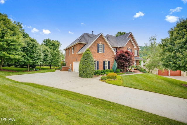 117 Quail Heights Ct, Kingsport, TN 37663 - view of front of house featuring brick siding, concrete driveway, a garage, and a front lawn