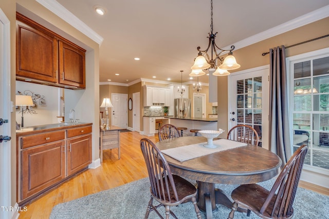 117 Quail Heights Ct, Kingsport, TN 37663 - dining area with a chandelier, light wood-style flooring, crown molding, recessed lighting, and baseboards