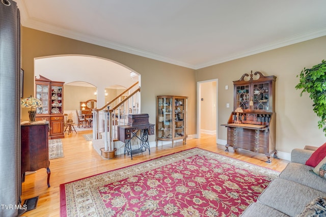 117 Quail Heights Ct, Kingsport, TN 37663 - living room with arched walkways, ornamental molding, wood finished floors, baseboards, and stairway