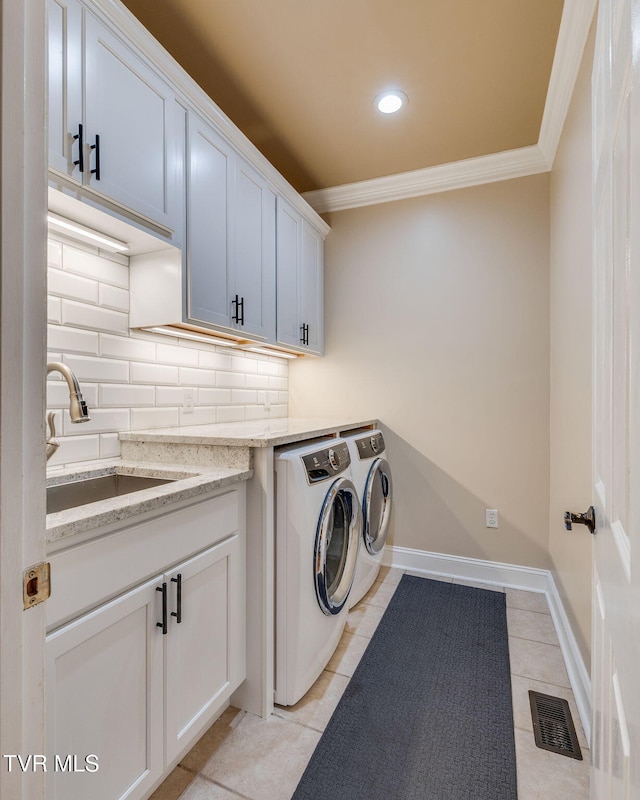117 Quail Heights Ct, Kingsport, TN 37663 - laundry area with washer and dryer, cabinet space, ornamental molding, light tile patterned floors, and recessed lighting