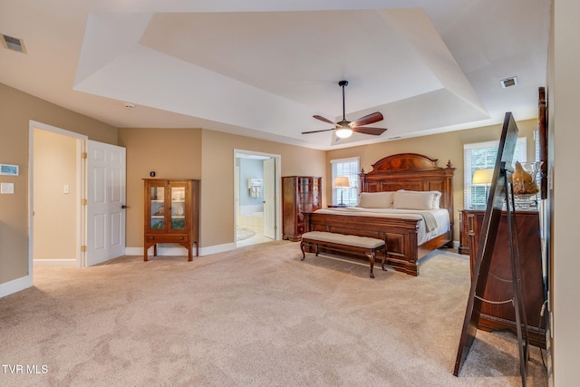 117 Quail Heights Ct, Kingsport, TN 37663 - bedroom featuring a tray ceiling, light colored carpet, baseboards, and ensuite bathroom