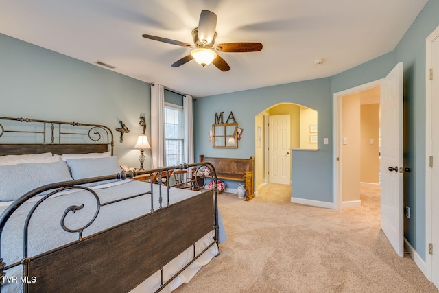 117 Quail Heights Ct, Kingsport, TN 37663 - bedroom featuring arched walkways, light carpet, baseboards, and ceiling fan