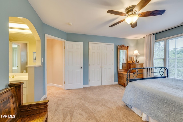 117 Quail Heights Ct, Kingsport, TN 37663 - carpeted bedroom with arched walkways, a closet, baseboards, and a ceiling fan