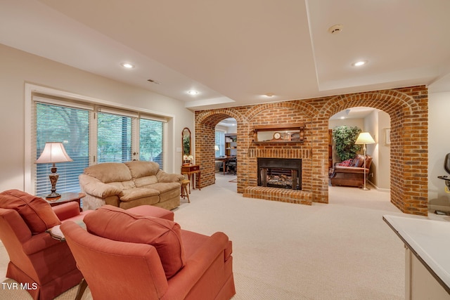 117 Quail Heights Ct, Kingsport, TN 37663 - living room featuring arched walkways, light carpet, recessed lighting, and a fireplace