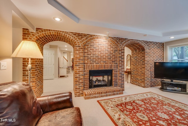 117 Quail Heights Ct, Kingsport, TN 37663 - carpeted living area with recessed lighting, a fireplace, brick wall, and arched walkways