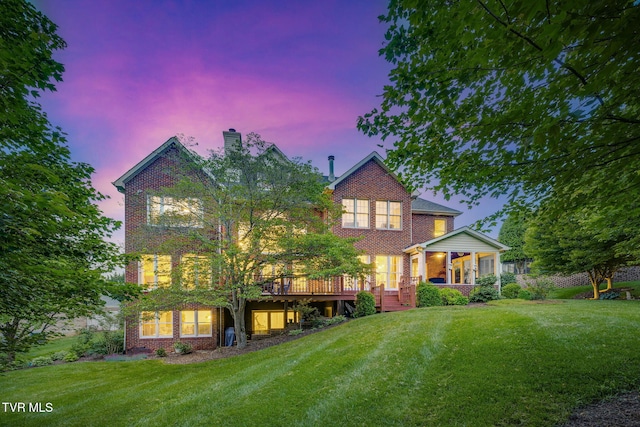 117 Quail Heights Ct, Kingsport, TN 37663 - view of front of home featuring brick siding, a lawn, a chimney, and a wooden deck