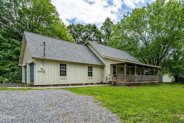 122 Spring Hollow Ln, Jonesborough, TN 37659 - view of front of house featuring a porch, a shingled roof, board and batten siding, asphalt driveway, and a front lawn