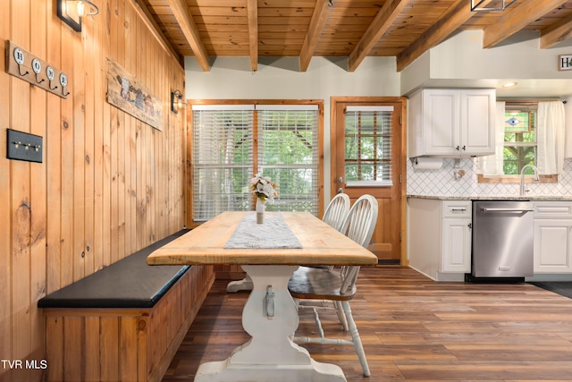 122 Spring Hollow Ln, Jonesborough, TN 37659 - dining space featuring plenty of natural light, wooden walls, wooden ceiling with exposed beams, and wood finished floors