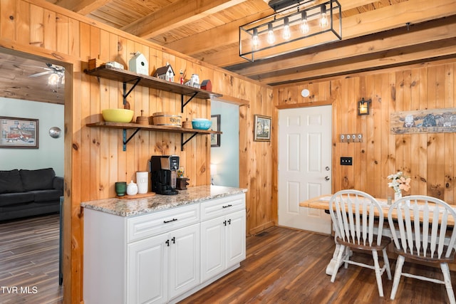 122 Spring Hollow Ln, Jonesborough, TN 37659 - kitchen featuring open shelves, wooden walls, dark wood-type flooring, white cabinetry, and a ceiling fan