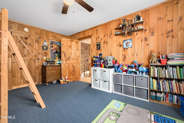 122 Spring Hollow Ln, Jonesborough, TN 37659 - playroom featuring carpet flooring, wooden walls, and a ceiling fan