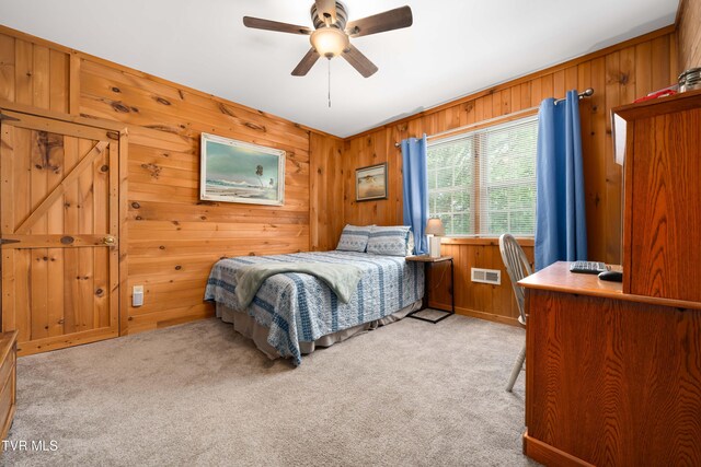 122 Spring Hollow Ln, Jonesborough, TN 37659 - bedroom featuring light carpet, wood walls, and ceiling fan