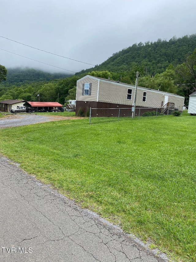 2807 E 6th Ave, Big Stone Gap, VA 24219 - view of front facade featuring a wooded view and a front lawn