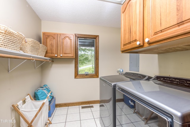 14346 White Top Vw, Abingdon, VA 24210 - laundry room with cabinet space, washer and dryer, baseboards, light tile patterned floors, and a textured ceiling