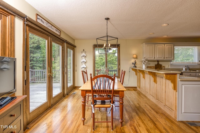 14346 White Top Vw, Abingdon, VA 24210 - dining room with a textured ceiling, a chandelier, light wood-style flooring, recessed lighting, and baseboards
