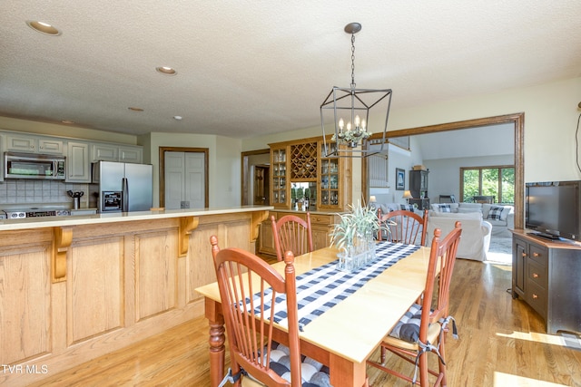 14346 White Top Vw, Abingdon, VA 24210 - dining room featuring light wood finished floors, a chandelier, a textured ceiling, and recessed lighting