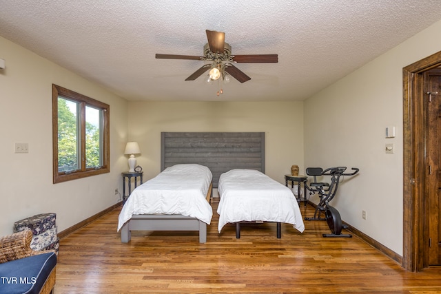 14346 White Top Vw, Abingdon, VA 24210 - bedroom featuring wood finished floors, baseboards, a textured ceiling, and ceiling fan
