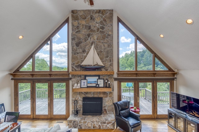14346 White Top Vw, Abingdon, VA 24210 - living room featuring wood finished floors, a stone fireplace, high vaulted ceiling, and recessed lighting
