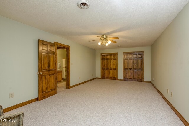 14346 White Top Vw, Abingdon, VA 24210 - unfurnished bedroom featuring light colored carpet, multiple closets, baseboards, and a textured ceiling