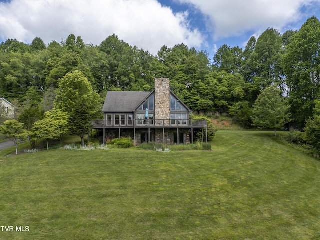 14346 White Top Vw, Abingdon, VA 24210 - back of house featuring a chimney, a lawn, a deck, and a view of trees