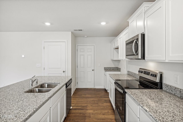 1133 Aspen Ter, Greeneville, TN 37745 - kitchen featuring stainless steel appliances, a sink, dark wood-type flooring, white cabinetry, and light stone counters