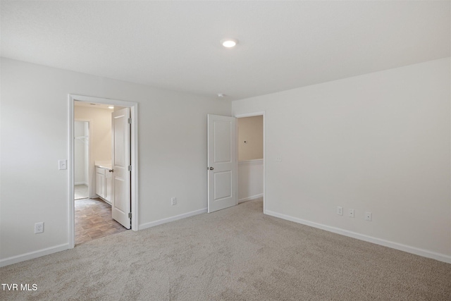 1133 Aspen Ter, Greeneville, TN 37745 - unfurnished bedroom with light colored carpet, baseboards, recessed lighting, and ensuite bathroom