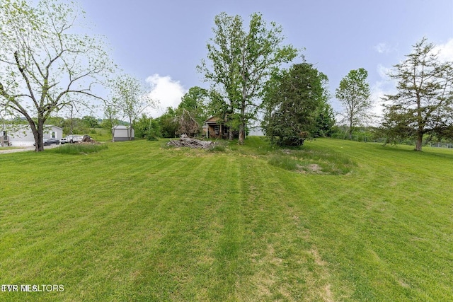 2170 Lone Mountain Rd, Tazewell, TN 37879 - view of green lawn with an outbuilding
