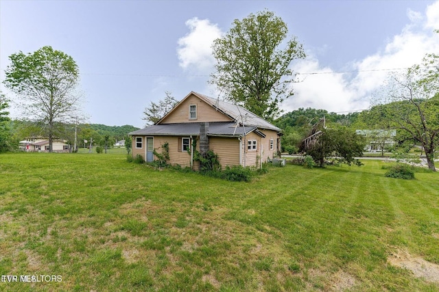 2170 Lone Mountain Rd, Tazewell, TN 37879 - view of property exterior with a yard and metal roof