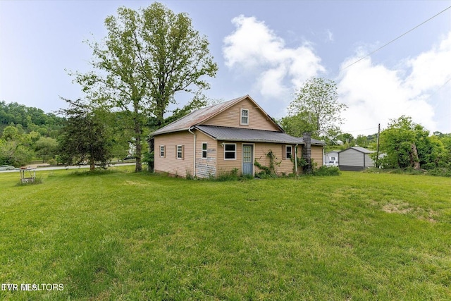 2170 Lone Mountain Rd, Tazewell, TN 37879 - rear view of property with a yard and metal roof