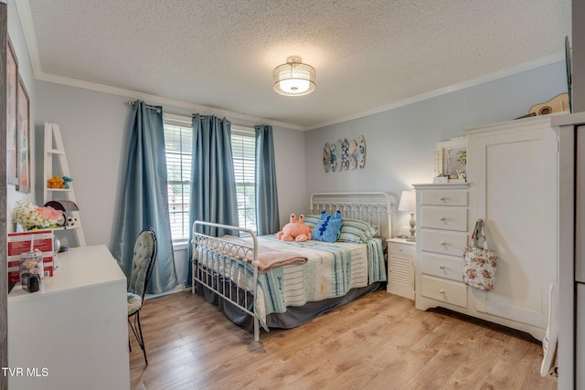 1734 Clear Springs Rd, Limestone, TN 37681 - bedroom featuring crown molding, light wood-style flooring, and a textured ceiling