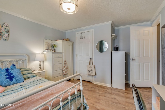 1734 Clear Springs Rd, Limestone, TN 37681 - bedroom with light wood-style floors, ornamental molding, a textured ceiling, and baseboards