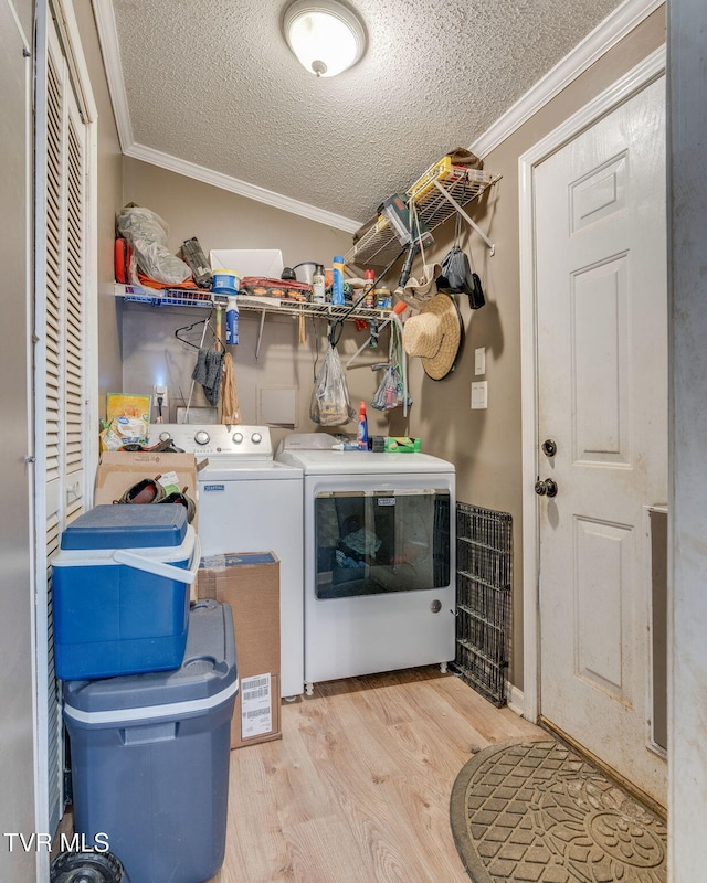 1734 Clear Springs Rd, Limestone, TN 37681 - laundry area with independent washer and dryer, ornamental molding, light wood finished floors, and a textured ceiling
