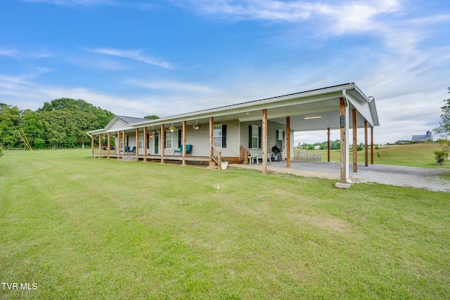 1734 Clear Springs Rd, Limestone, TN 37681 - view of front facade with covered porch, a front lawn, and driveway