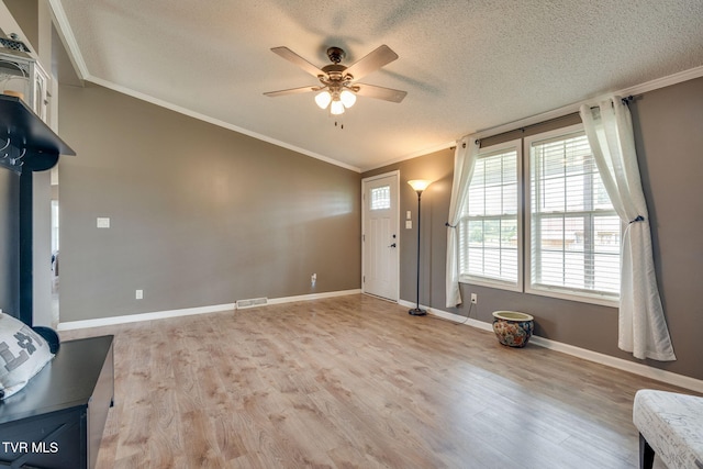 1734 Clear Springs Rd, Limestone, TN 37681 - foyer featuring ornamental molding, a ceiling fan, a textured ceiling, vaulted ceiling, and light wood-style flooring