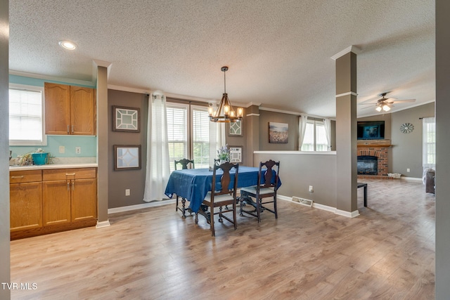 1734 Clear Springs Rd, Limestone, TN 37681 - dining space featuring crown molding, a textured ceiling, plenty of natural light, a chandelier, and a ceiling fan
