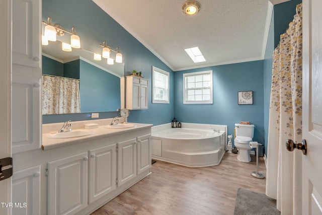 1734 Clear Springs Rd, Limestone, TN 37681 - full bath featuring crown molding, vaulted ceiling, toilet, double vanity, and wood finished floors