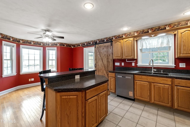 2361 Old Stage Rd, Afton, TN 37616 - kitchen featuring stainless steel dishwasher, a sink, plenty of natural light, and a kitchen bar
