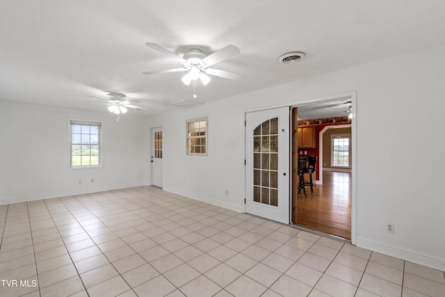 2361 Old Stage Rd, Afton, TN 37616 - unfurnished room featuring a ceiling fan, plenty of natural light, and baseboards