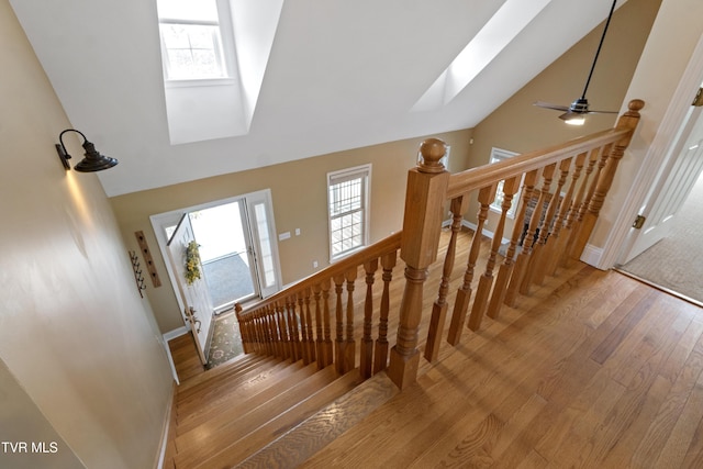 2361 Old Stage Rd, Afton, TN 37616 - stairway with a skylight, high vaulted ceiling, wood finished floors, healthy amount of natural light, and baseboards