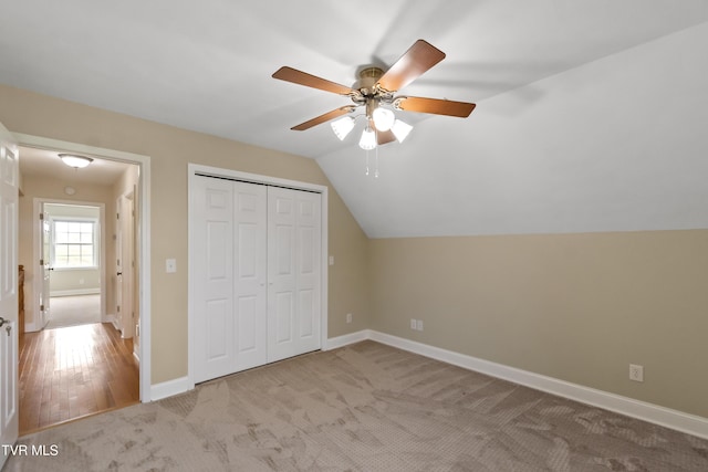 2361 Old Stage Rd, Afton, TN 37616 - unfurnished bedroom with carpet flooring, a closet, baseboards, lofted ceiling, and a ceiling fan
